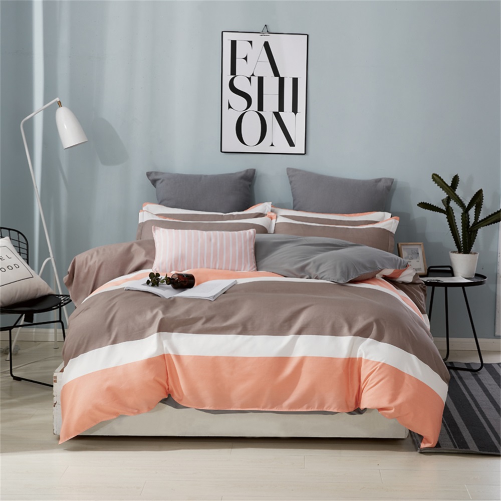 OMONNES Four Sets of Crisp Sheets and Quilts on The Bed with Striped Oranges