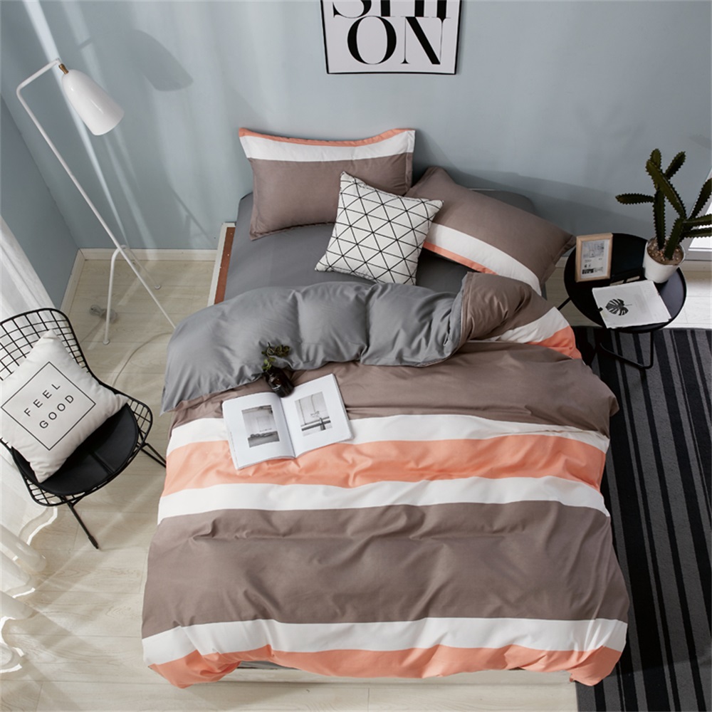 OMONNES Four Sets of Crisp Sheets and Quilts on The Bed with Striped Oranges
